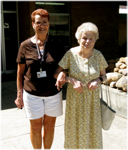 Client being escorted at Aspen Care Center
